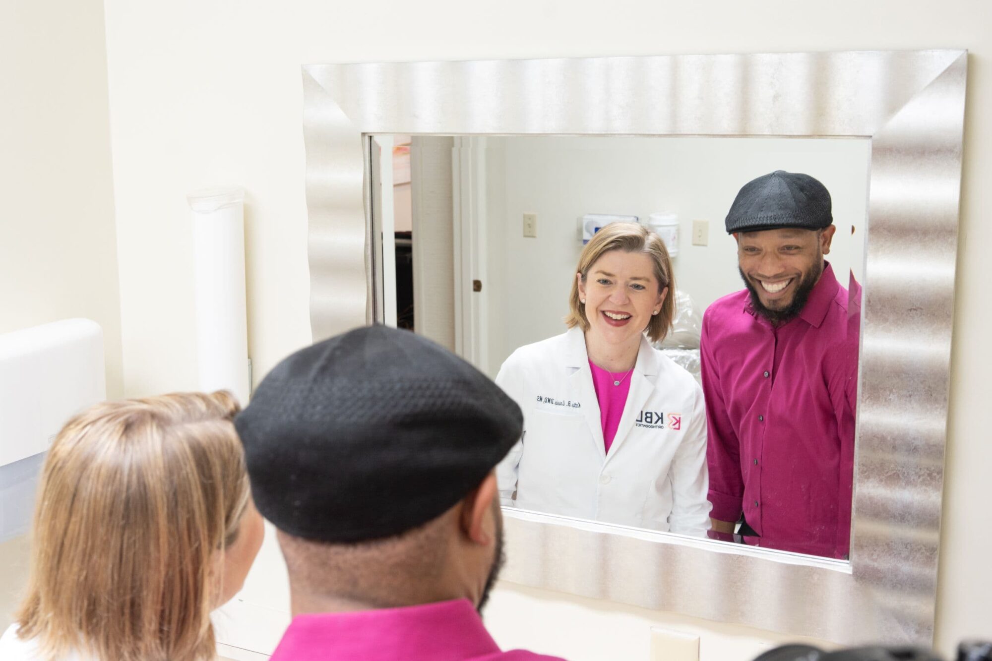 team member and patient smiling during visit
